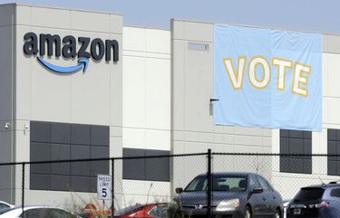 FILE – In this Tuesday, March 30, 2021 file photo, A banner encouraging workers to vote in labor balloting is shown at an Amazon warehouse in Bessemer, Ala. Nearly 6,000 Amazon warehouse workers in Bessemer, Alabama, have voted on whether or not to form a union. But the process to tally all the ballots and determine an outcome will continue for a second week, according to the National Labor Relations Board, a government agency thatâ€™s conducting the election.  (AP Photo/Jay Reeves, File) NYMV401 NYMV401