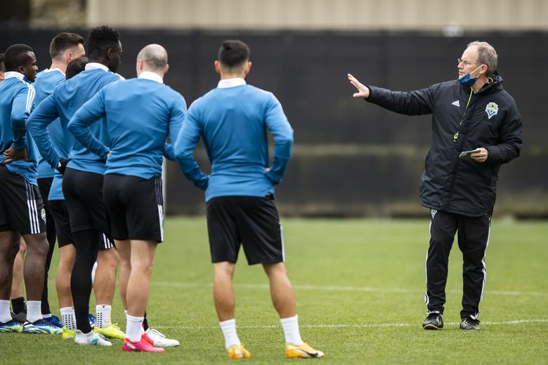 Seattle Sounders head coach Brian Schmetzer talks to players during training at Starfire Sports in Tukwila on March 20, 2021. (Bettina Hansen / The Seattle Times)