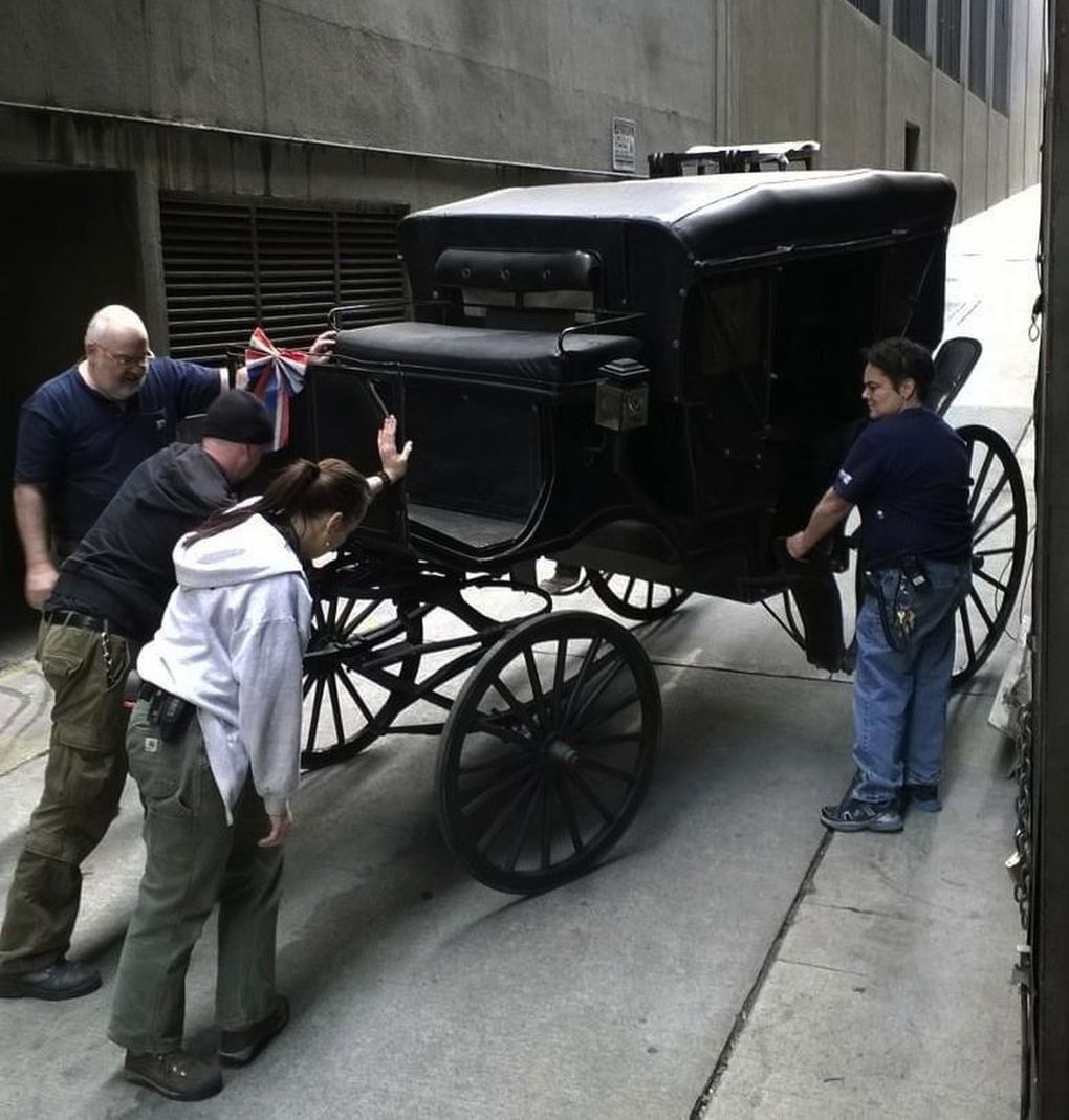 Diana J. Gervais helps load a carriage into the load door at the 5th Avenue Theatre for a 2014 production of “A Room with a View.” Gervais retired earlier than she originally planned after the coronavirus pandemic shut down all live entertainment and stagehands found it tough to get work. (Lee DeLorme)