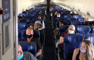 Masked passengers fill a Southwest Airlines flight from Burbank to Las Vegas on June 3, with middle seats left open. (Christopher Reynolds/The Los Angeles Times/TNS) 13756306W 13756306W