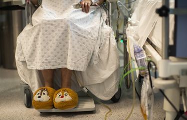 A COVID-19 patient rests in a chair in the intensive care ward of the CHU Liege hospital, in Liege, Belgium, Thursday, April 15, 2021. (AP Photo/Francisco Seco) FS104 FS104