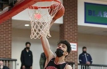 Chet Holmgren, shown here dunking against Totino-Grace in the Class 3A, section 4 championship on Friday, was named the Wootten National Player of the Year in boys’ basketball.
