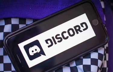 The Discord Inc. logo on a smartphone arranged in Hastings-on-Hudson, New York, on Tuesday, March 23, 2021. Microsoft Corp. is in talks to acquire Discord Inc., a video-game chat community, for more than $10 billion, according to people familiar with the matter. Photographer: Tiffany Hagler-Geard/Bloomberg 775637604