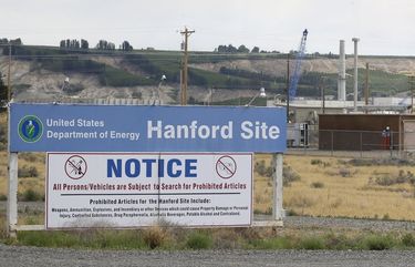 FILE – In this July 9, 2014 file photo, a sign informs visitors of prohibited items on the Hanford Site near Richland, Wash. The U.S. Department of Energy has confirmed that two underground structures at the decommissioned Hanford nuclear reservation in Washington state have been stabilized after they were deemed at risk of collapsing and spreading radioactive contamination into the air. (AP Photo/Ted S. Warren, File) FX204 FX204