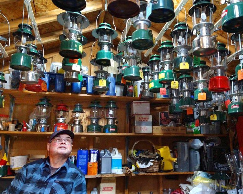Times reporter Ron Judd with part of his collection of working vintage Coleman lanterns. (Meri-Jo Borzilleri)