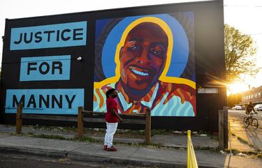 Jeremy Dashiell CQ visits a mural honoring Manuel Ellis CQ in Tacoma. In high school, Dashiell and Ellis shared a love of track, basketball and music. The friends reconnected during the last year, meeting one another’s children and making music together.  “He was a genuine, humble person,” says Dashiell. “I’m going to pray for justiceÉ. No one deserves to be treated the way he did.” 214911