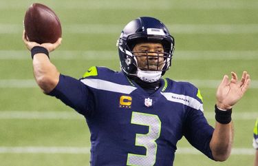 Seattle Seahawks quarterback Russell Wilson (3) makes a 2nd quarter pass as the Los Angeles Rams play the Seattle Seahawks at Lumen Field in Seattle on January 9, 2021. Seattle Seahawks offensive guard Jordan Simmons (66) is at right.  216070