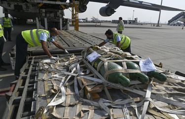 Relief supplies from the United States in the wake of India’s COVID-19 situation arrive at the Indira Gandhi International Airport cargo terminal in New Delhi, India, Friday, April 30, 2021. (Prakash Singh/Pool via AP) AFD105 AFD105