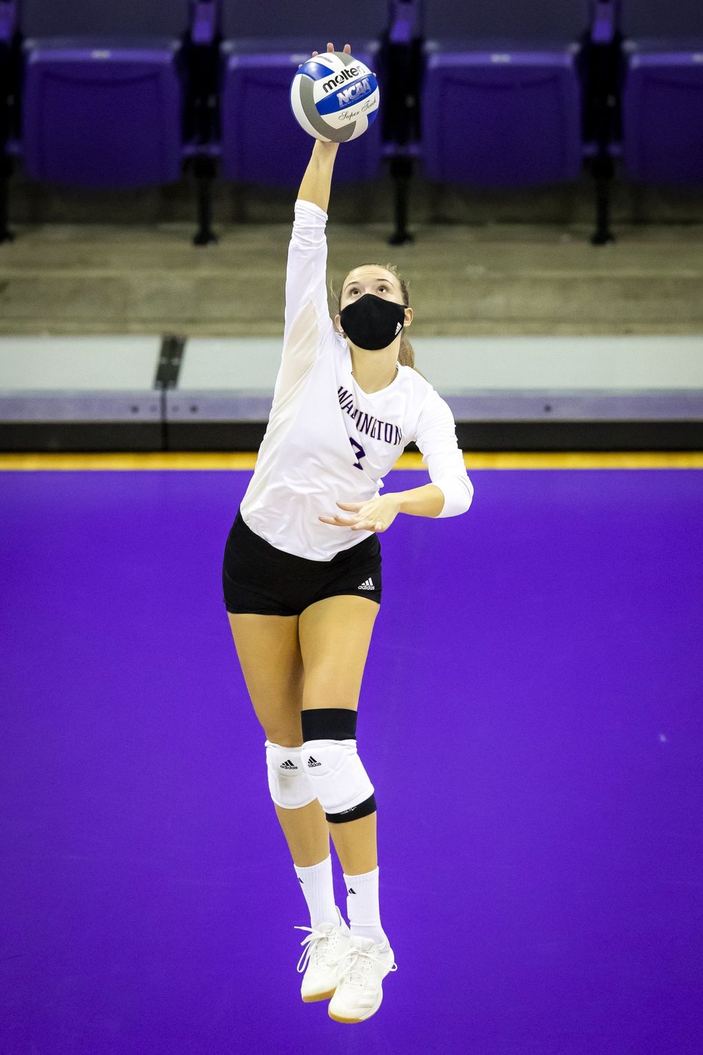 Washington setter Ella May Powell serves as the University of Washington Huskies take on the Oregon State Beavers for a volleyball game Saturday February 6, 2021 at Alaska Airlines Arena in Seattle. (Bettina Hansen / The Seattle Times)