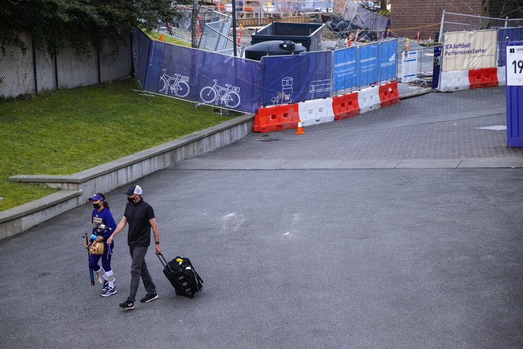 Athletic trainer Rob Scheidegger heads over to Husky Softball Stadium with the team for Friday’s game against Seattle University. (Dean Rutz / The Seattle Times)