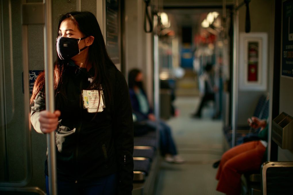 My-Huyen Pham commutes from South Seattle to work at Virginia Mason Medical Center on April 21. She said her vaccination status and the frequent cleanings of Metro buses make her feel safe riding transit. (Erika Schultz / The Seattle Times)