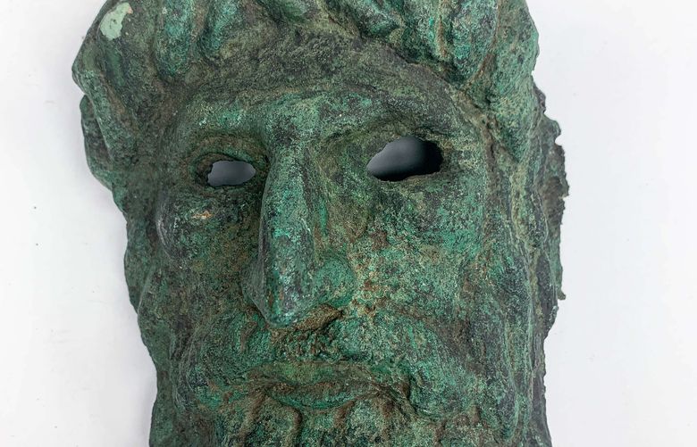 In an undated image provided via Manhattan District Attorney’s Office, a bronze mask of Silenus, circa 2nd Century. On Monday, April 19, 2021, 33 of antiquities, valued at $1.8 million, were handed over to the Afghan ambassador, Roya Rahmani, by the Manhattan district attorney’s office and the Department of Homeland Security, at a ceremony in New York. (via Manhattan District Attorney’s Office via The New York Times) — FOR EDITORIAL USE ONLY. —