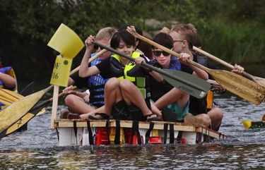 In synch, Boy Scout Troop 520 gets off to a fast start in their open category heat at the Seafair Milk Carton Derby on Green Lake, though they did almost collide with the competitors, right, at the beginning.

 Sat. July 16, 2016, LO Linesonly

Ref to more photos online