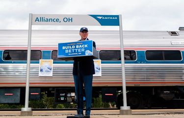 FILE — Joe Biden, then the Democratic presidential nominee, campaigns at the Amtrak station in Alliance, Ohio, on Sept. 30, 2020. Amtrak says it plans to restore daily service on 12 of its long-distance lines and recall 1,200 workers who had been furloughed.  (Gabriela Bhaskar/The New York Times)