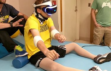 An undated photo provided by Michigan Medicine shows Michael Heinrich, who lost the use of the lower half of his body after an accident, as he undergoes virtual reality therapy. While use of the gaming technology for improving physical ailments is still in the early stages, it shows promise — and it’s fun. (Michigan Medicine via The New York Times)   — NO SALES; FOR EDITORIAL USE ONLY WITH NYT STORY SLUGGED BIRDS FALSE ADVERTISING BY EMILY ANTHES FOR APRIL 21, 2021. ALL OTHER USE PROHIBITED. —