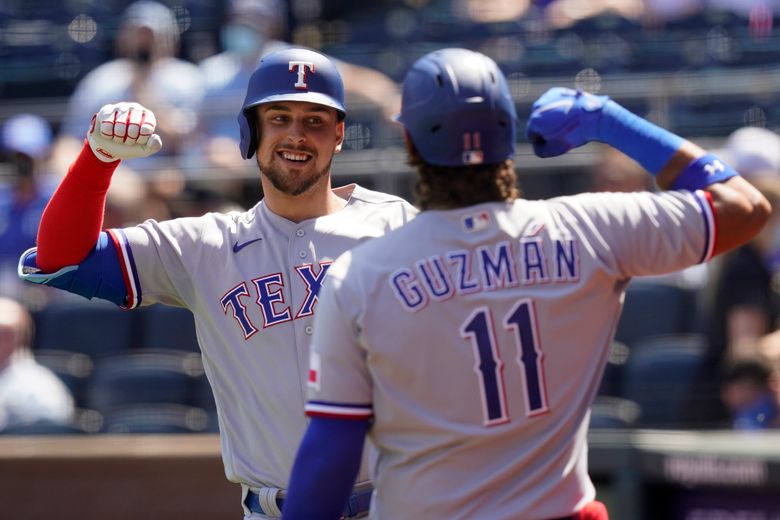 Nathaniel Lowe of the Texas Rangers celebrates a three-run home