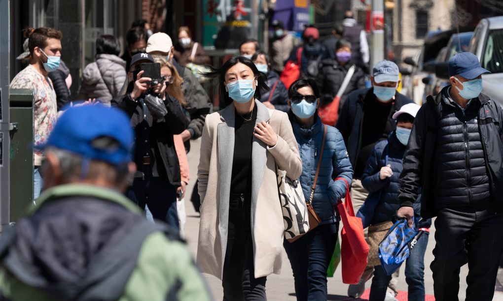 People walk on the street, Monday, April 26, 2021 in New York. According to a new study and data from the U.S. Census Bureau, thousands of people migrated out of the nation’s largest metropolitan areas and into smaller ones during the pandemic. The pattern isn’t new, but the outbreak exacerbated the trend. (AP Photo/Mark Lennihan)