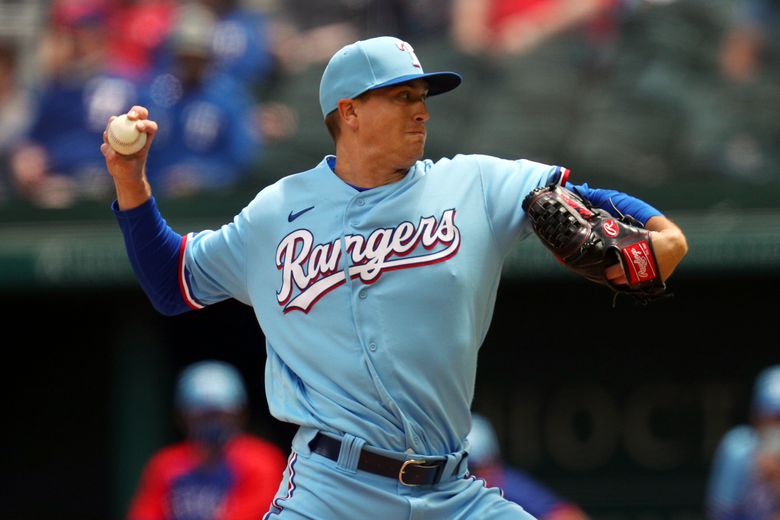 ARLINGTON, TX - APRIL 05: Texas Rangers starting pitcher Cole