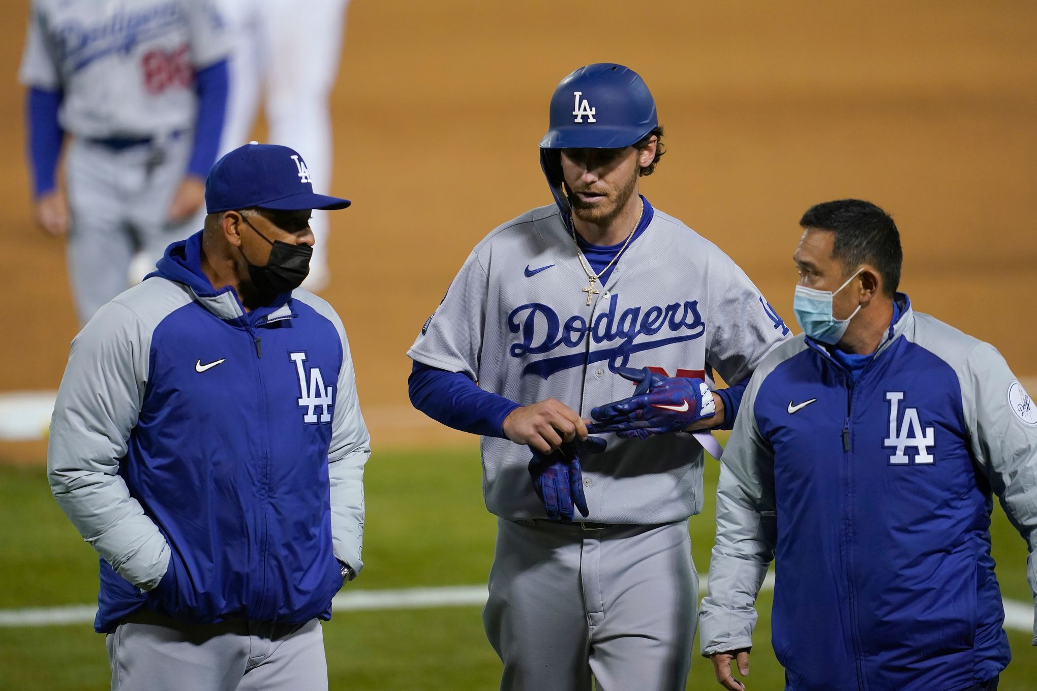Los Angeles Dodgers' Cody Bellinger is welcomed home by teammates