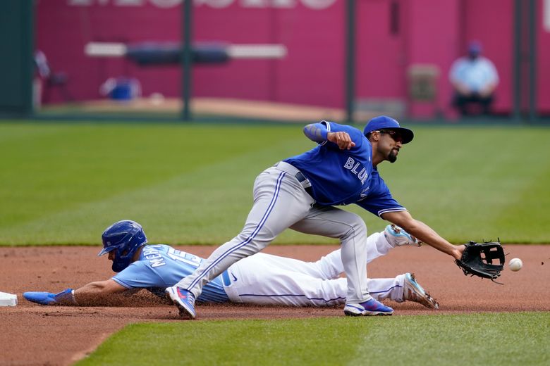 Toronto Blue Jays' Whit Merrifield runs to first base for a single