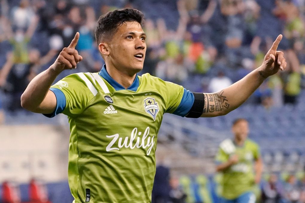 Seattle Sounders forward Fredy Montero celebrates after scoring a goal against Minnesota United during the second half of an MLS soccer match Friday, April 16, 2021, in Seattle. The Sounders won 4-0. (AP Photo/Ted S. Warren)