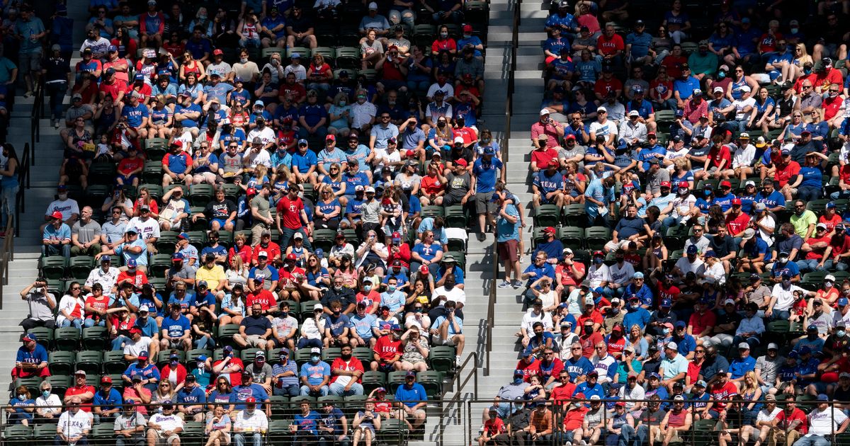 Texas Rangers fill stands with fans, who accept 'calculated risk