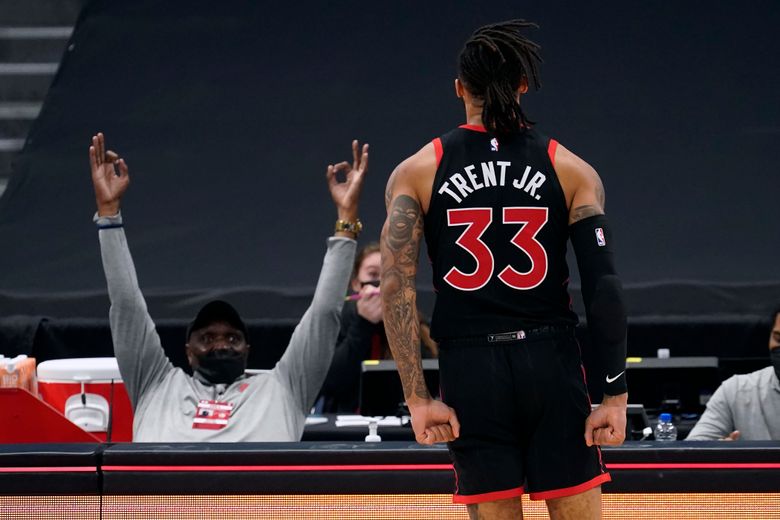 Toronto Raptors' Kyle Lowry, left, celebrates his three point shot