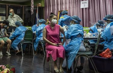 A COVID-19 vaccination center in Bangkok on April 28, 2021. Big-power muscle flexing helps explain much of the world’s vaccine inequities, but there’s another reason behind insufficient doses: The challenge of making them is unprecedented. (Adam Dean/The New York Times) XNYT64