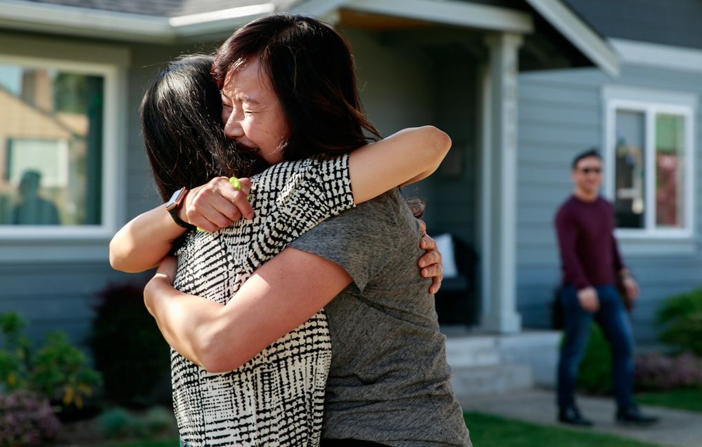 Christina Fairley, facing camera, hugs her sister Mimi Schuppler for the first time in more than a year outside Fairley’s West Seattle home in late April. Their brother, Tony Chung of Bellevue, looks on from behind. After Fairley and Chung’s second vaccinations, Schuppler traveled from Austria, quarantined and tested. The siblings reunited in Fairley’s front yard, played with her son Lachlan, 6, and caught up over a dinner. “It was a mix of joy and relief to be reunited with my sister and brother,” Fairley said. “I’ve so missed our family time and to finally be together brought such joy. What I wasn’t expecting was the sense of relief I experienced. It’s been a long year of being apart and worrying about the health of my family. To reach this point where it feels like we’re coming out the other side fairly unscathed was like the release of a long breath I didn’t know I was even holding.” (Erika Schultz / The Seattle Times)