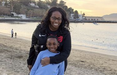 In this photo provided by Tanya Hayles, Hayles poses with her son Jackson, 7, in this undated photo. Hayles, founder of Black Moms Connection, an online network of more than 16,000 Black mothers with chapters across North America and Asia, said she has noticed discussions among members about how remote learning has allowed Black mothers to better shield their children from racism. (Courtesy of Tanya Hayles via AP) NYRD506 NYRD506