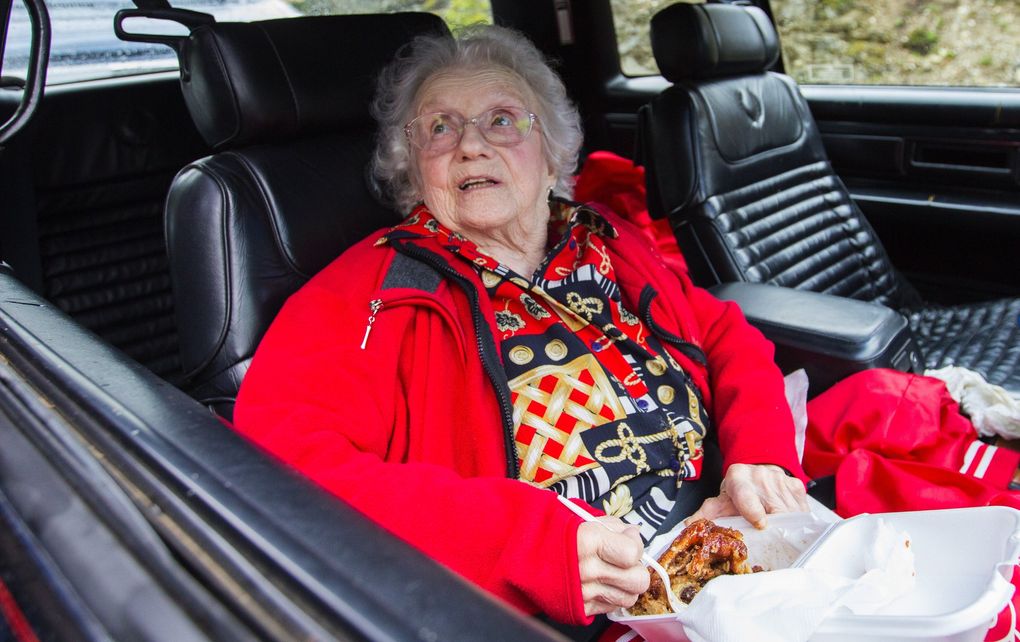 Ethel Madrene Clark, 95, enjoys one of her famous cinnamon rolls in 2017. Clark, known as “Tootsie,” marked the annual reopening of Highway 20 by passing out pastries and coffee to drivers for decades. She died in 2018. (Mike Siegel / The Seattle Times, file)