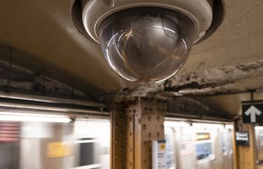 FILE – In this Oct. 7, 2020, file photo, a video surveillance camera is installed on the ceiling above a subway platform in the Court Street station in the Brooklyn borough of New York. (AP Photo/Mark Lennihan, File) 
