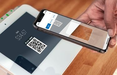 PayPal QR Code being scanned from a Clover POS device.