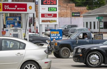 Customers wait in line to purchase fuel at the Duck-Thru in Scotland Neck, N.C., on Tuesday, May 11, 2021. The station was doing a brisk business on Tuesday as news of the cyberattack on the Colonial Pipeline spread fear of a gas shortage in rural North Carolina. (Robert Willett/The News & Observer via AP) NCRAL601 NCRAL601