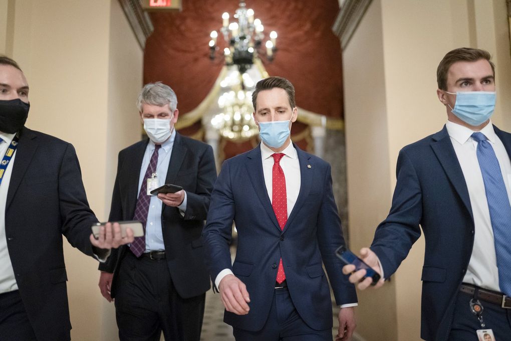 After violent protesters loyal to President Donald Trump stormed the U.S. Capitol on Jan. 6, 2021, Sen. Josh Hawley, R-Mo., walks to the House chamber to challenge the results of the presidential election in Pennsylvania during the joint session of the House and Senate to count the Electoral College votes cast in November’s election, at the Capitol in Washington. (J. Scott Applewhite / The Associated Press)