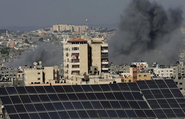 Smoke rises after Israeli airstrikes in Gaza in Gaza City, Tuesday, May 11, 2021. (AP Photo/Adel Hana) XAH120 XAH120