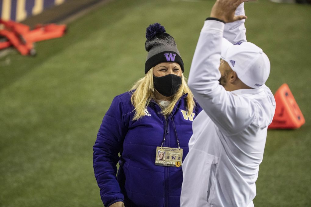 Jen Cohen and Jimmy Lake celebrate Washington’s win over Utah. The University of Utah played the Washington Huskies in Pac-12 Football November 28, 2020 at Husky Stadium, In Seattle, WA. 215770 (Dean Rutz / The Seattle Times)
