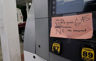 A hand written sign is posted on a gas pump, showing that the service station is out of all grades of fuel Wednesday, May 12, 2021, in Charlotte, N.C.  Several gas stations in the Southeast reported running out of fuel, primarily because of what analysts say is unwarranted panic-buying among drivers, as the shutdown of a major pipeline by hackers entered its fifth day.  (AP Photo/Chris Carlson) NCCC101 NCCC101