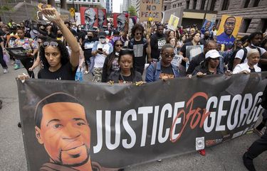 People march for the one year anniversary of George Floyd’s death on Sunday, May 23, 2021, in Minneapolis, Minn. (AP Photo/Christian Monterrosa) MNCM105 MNCM105