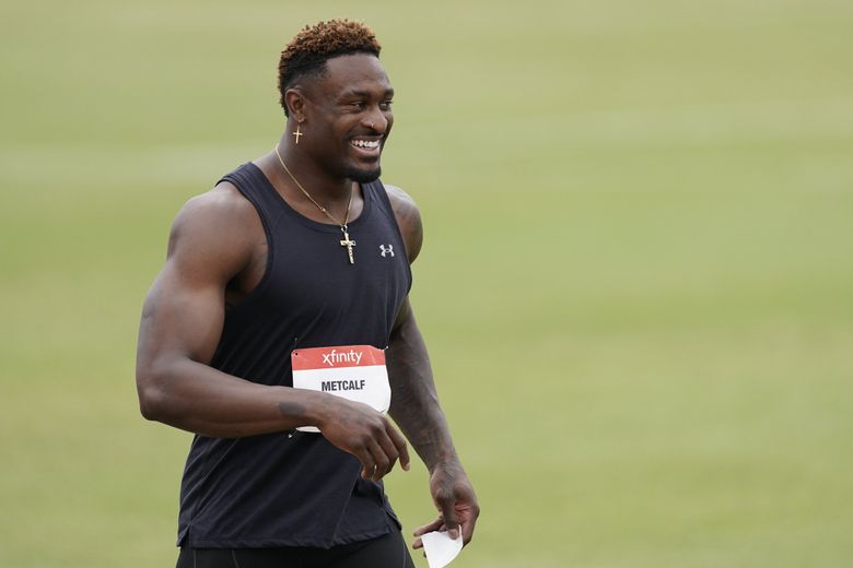 DK Metcalf keeps pace with Olympic-caliber sprinters in track debut