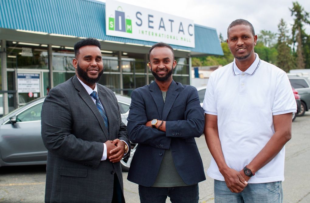 Abdirashid Hersi, from left, Faisal Mohamed and Mahamud Duale are co-owners of the SeaTac International Mall, earlier this month. (Erika Schultz / The Seattle Times)