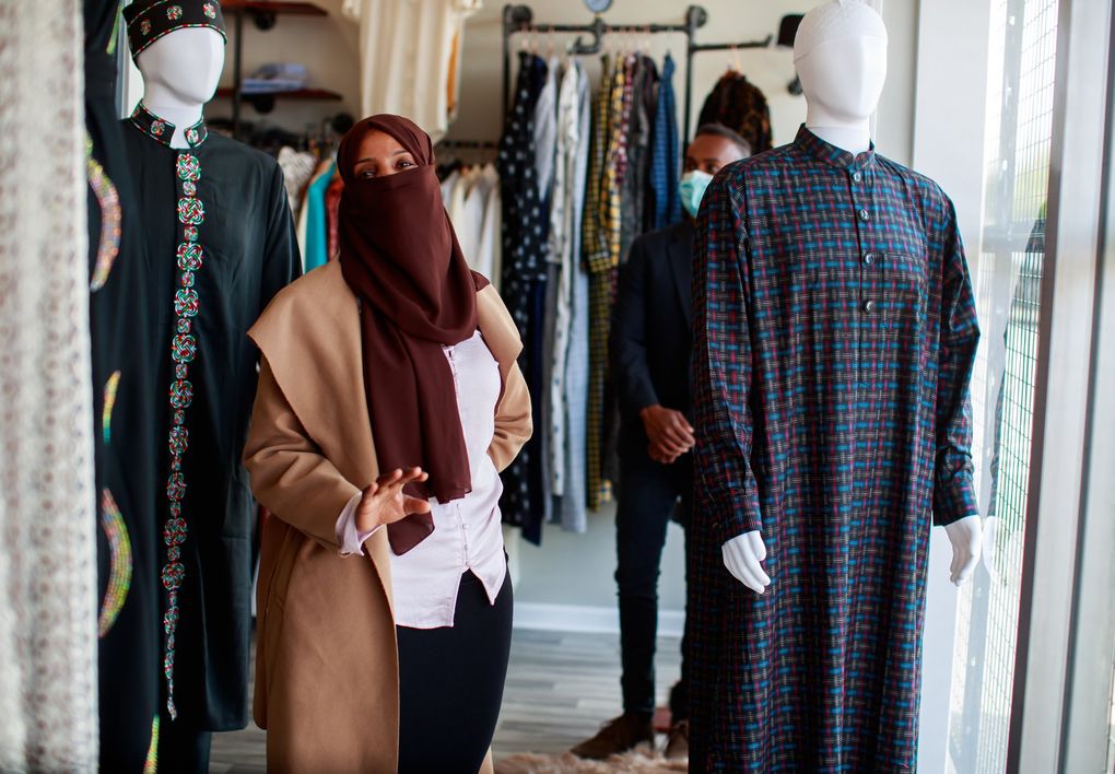 Najmo Hamud talks in front of her store, Fashion King, a clothing store for boys and men, at the SeaTac International Mall earlier this month. (Erika Schultz / The Seattle Times)
