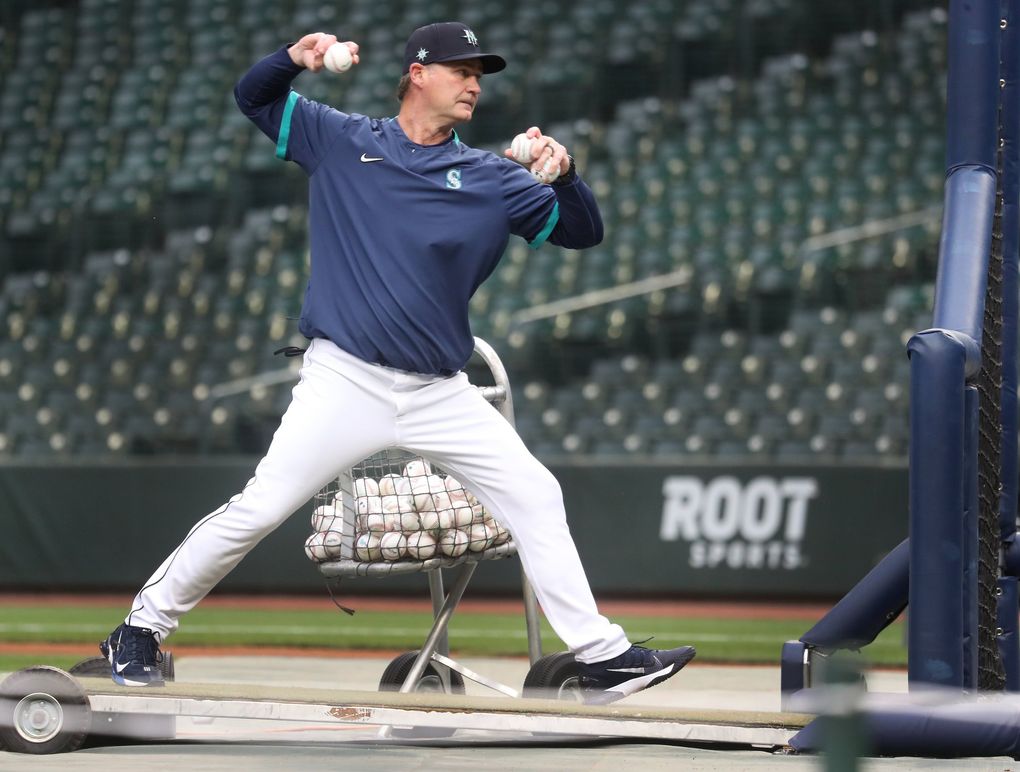 Mariners manager Scott Servais throws batting practice without his mask on before taking on the Tigers, Monday, May 17, 2021, in Seattle. (Ken Lambert / The Seattle Times)