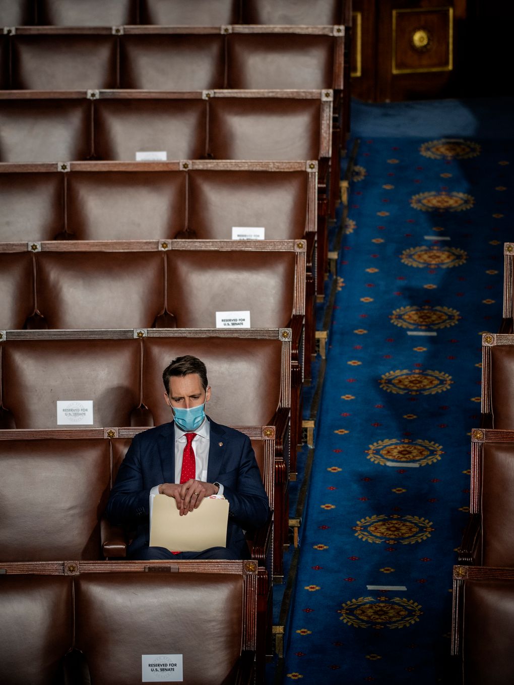 Hawley sits alone at the Capitol on Jan. 6, the day he challenged the certification of the election results. (Washington Post photo by Bill O’Leary).