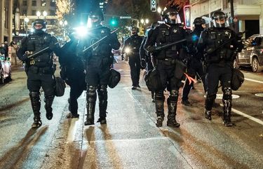 Police officers prepare to disperse protesters in Portland, Ore., on Nov. 4, 2020.  (Mason Trinca / The New York Times)