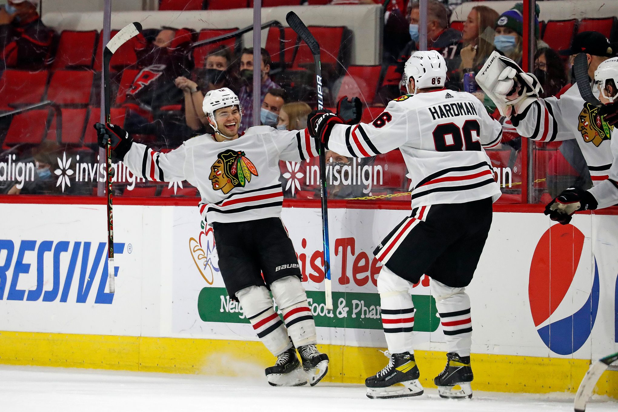 Chicago Blackhawks center Kirby Dach, right, celebrates his tying