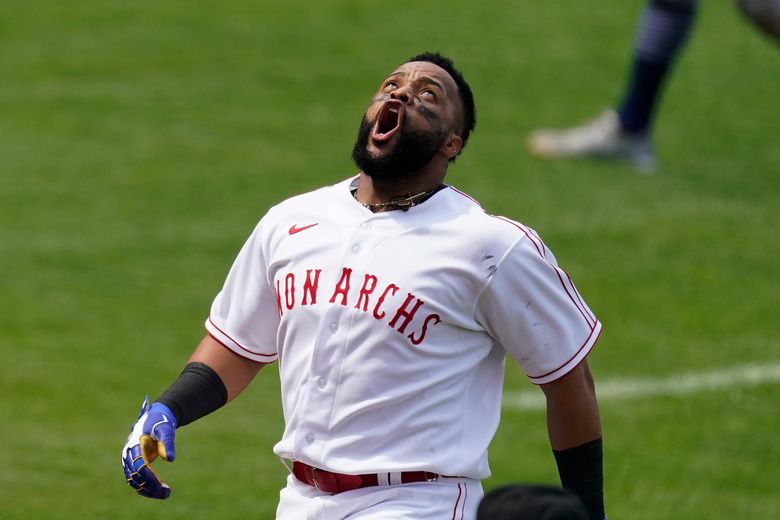 Kansas City Royals' Carlos Santana follows through on a swing against the  Detroit Tigers during the sixth inning of a baseball game in Kansas City, Mo.,  Monday, June 14, 2021. (AP Photo/Reed