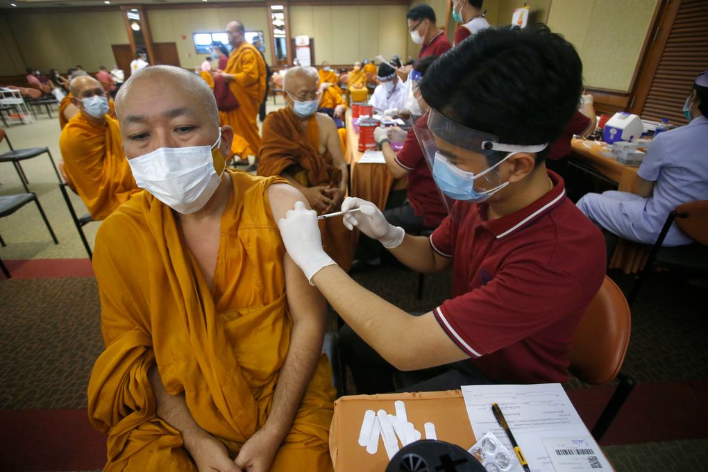 FILE – In this May 18, 2021, file photo, a health worker administers a dose of the Sinovac COVID-19 vaccine to Buddhist monk at Priest Hospital in Bangkok, Thailand. Thailand on Friday said it had detected its first locally transmitted cases of the coronavirus variant first found in India, even as it announced the formal rollout of its national vaccination plan from next month. (AP Photo/Anuthep Cheysakron,File)