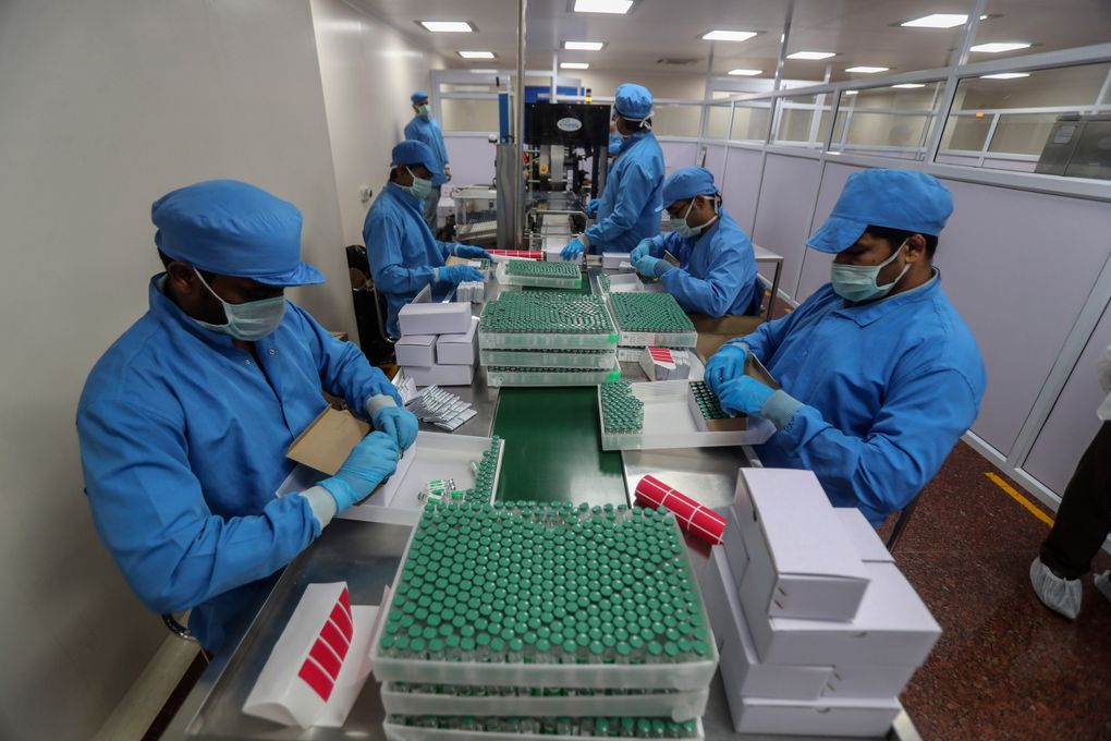 In this Jan. 21, 2021, file photo, employees pack boxes containing vials of Covishield, a version of the AstraZeneca vaccine at the Serum Institute of India in Pune, India.(AP Photo/Rafiq Maqbool)