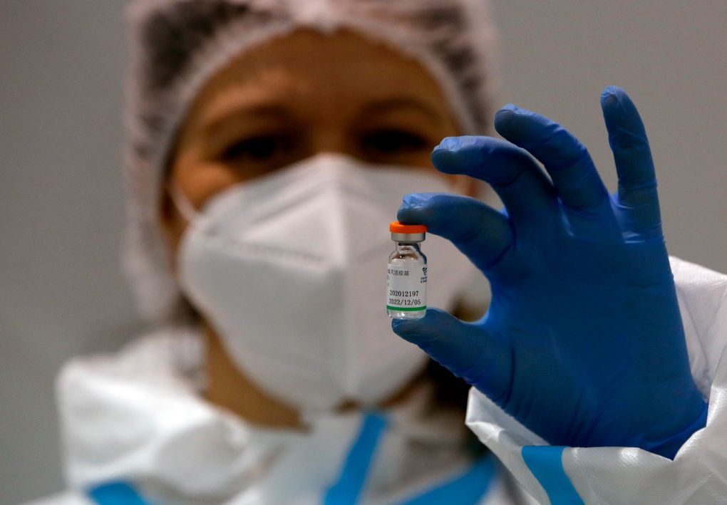 FILE – In this Tuesday, Jan. 19, 2021 file photo, a medical worker poses with a vial of the Sinopharm’s COVID-19 vaccine in Belgrade, Serbia. The World Health Organization gave emergency use authorization Friday to the Beijing COVID-19 vaccine. (AP Photo/Darko Vojinovic, file)